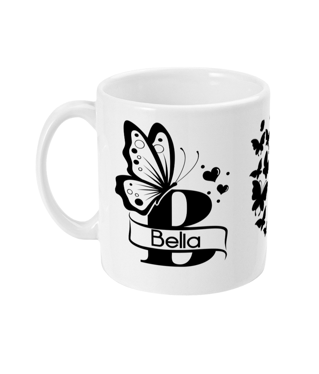 Personalised white mug with a black butterfly design, featuring the letter 'B' and the name 'Bella'.