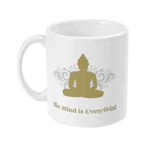 White ceramic mug with a gold Buddha silhouette and 'The Mind is Everything' quote in gold print against a light gray backdrop.