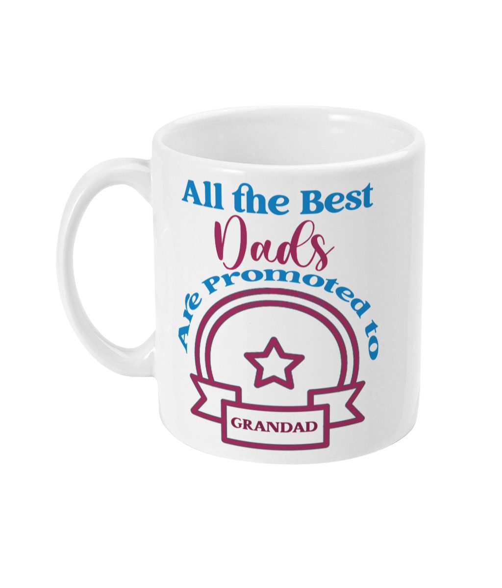 Cheerful white mug with playful 'All the Best Dads Are Promoted to Grandad' text and vibrant pink and blue design featuring 'GRANDAD'.