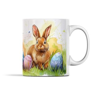 Brown rabbit surrounded by vibrant Easter eggs on a white ceramic mug