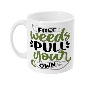 White ceramic mug with 'FREE WEEDS PULL YOUR OWN' in green and black text surrounded by playful leaves.