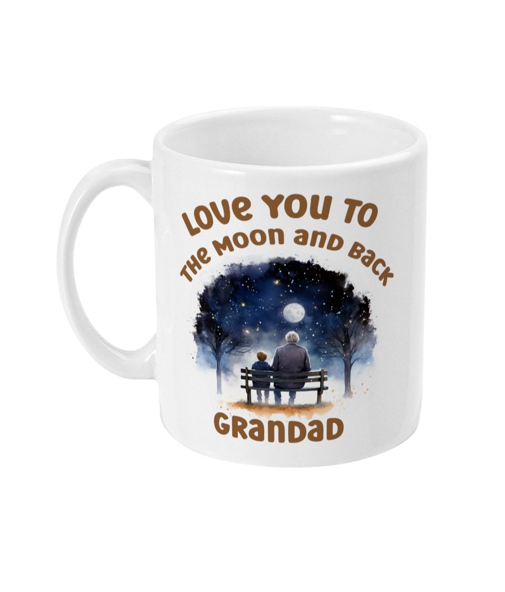 Intriguing white mug with a night scene graphic of a grandparent and grandchild under a starlit sky with 'Love You to the Moon and Back Grandad' text