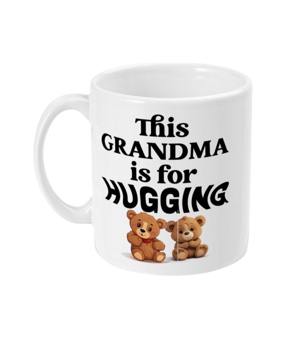 White mug with 'This GRANDMA is for HUGGING' text and two cheerful teddy bears graphic.