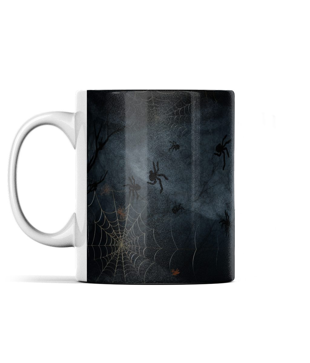 Dark mug with intricate cobwebs and spiders design in shades of grey and orange