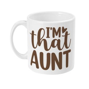 White ceramic mug with brown script-style text 'I'm that AUNT' and two heart shapes integrated into the design.