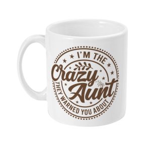 White ceramic mug with brown 'I'm the Crazy Aunt they warned you about' design surrounded by stars and plant motifs.