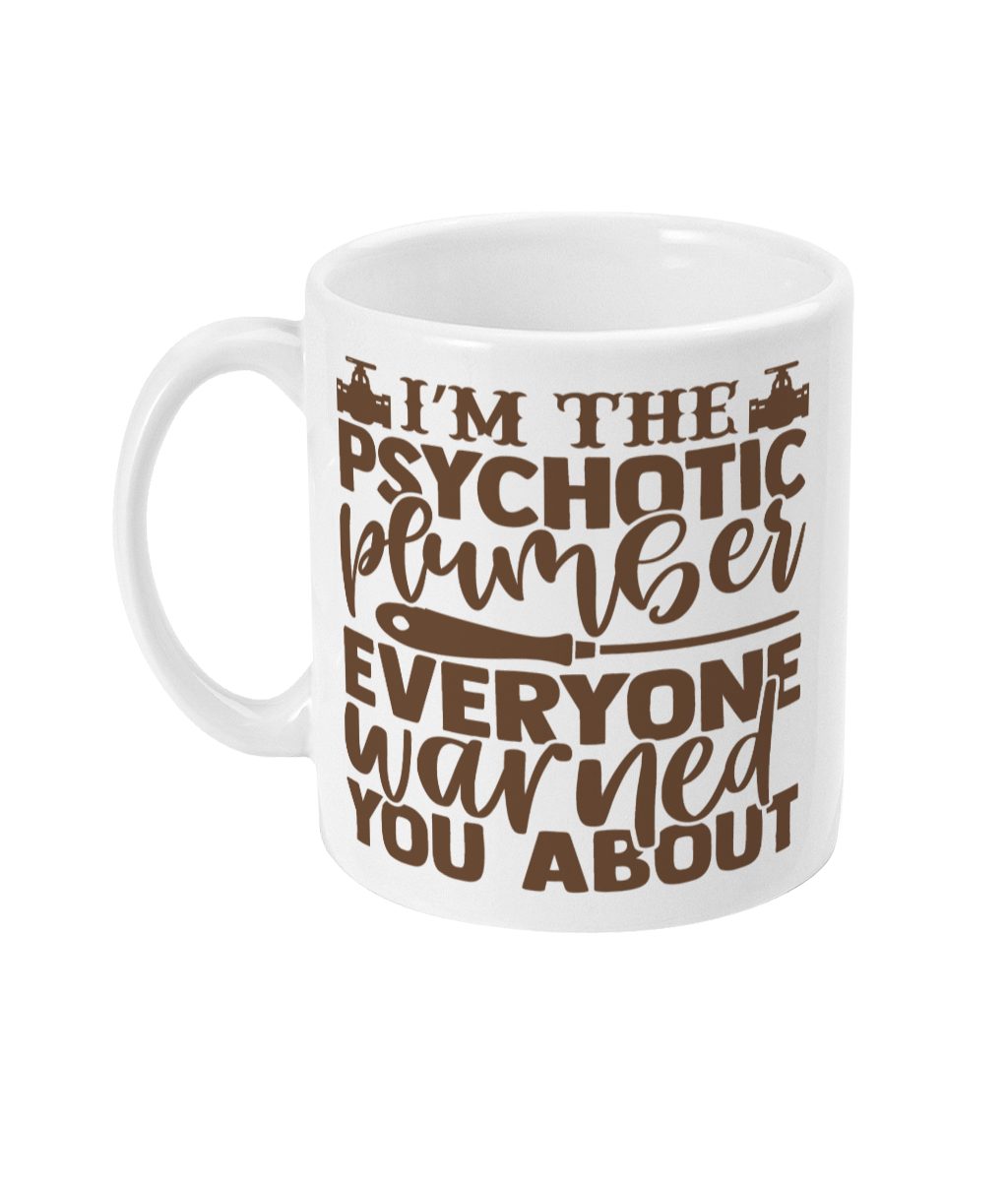White cylindrical mug with brown text 'I'M THE PSYCHOTIC PLUMBER EVERYONE WARNED YOU ABOUT' and plumbing tool graphics