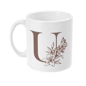 White ceramic mug featuring a large brown letter U with floral and butterfly designs.