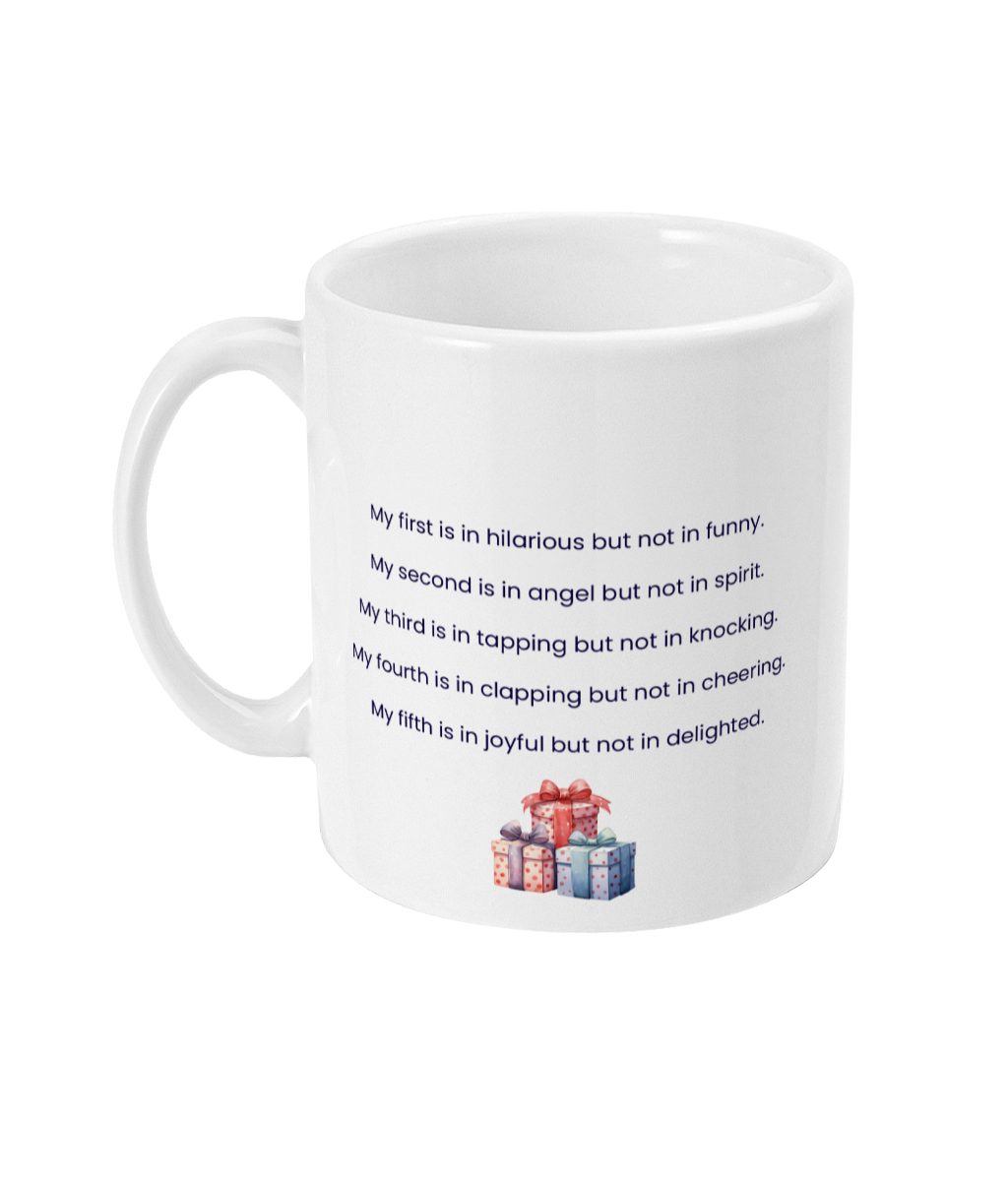 White ceramic Puzzle Enthusiast's Happy Birthday Mug with intricate word puzzle design and colorful gift box graphics.
