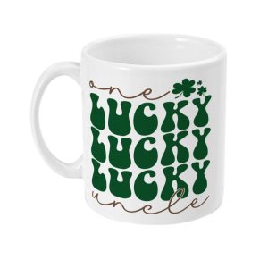 White ceramic mug with green 'LUCKY LUCKY LUCKY' text and brown script with a cloverleaf.