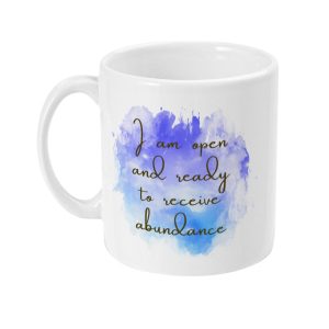 White ceramic mug with watercolor-style graphic in blue and purple, featuring 'I am open and ready to receive abundance' in cursive.