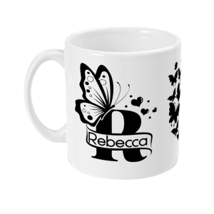 Personalised Letter R Monogram Butterfly Mug featuring a decorative butterfly, hearts, and the name 'Rebecca' on a white ceramic mug.