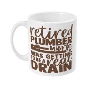 White ceramic mug with brown text 'Retired Plumber Work Was Getting to be a Real Drain'. Humorous and engaging design.