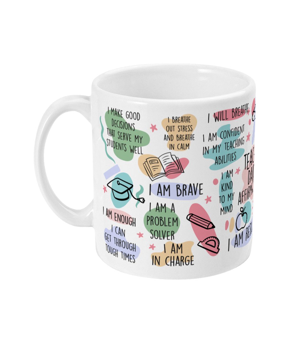 White ceramic mug with colourful text affirmations and graphic illustrations of books, stars, and more.