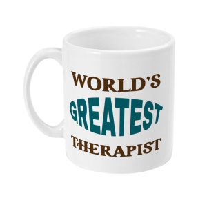White ceramic mug with bold text 'WORLD'S GREATEST THERAPIST' in brown and teal colors.