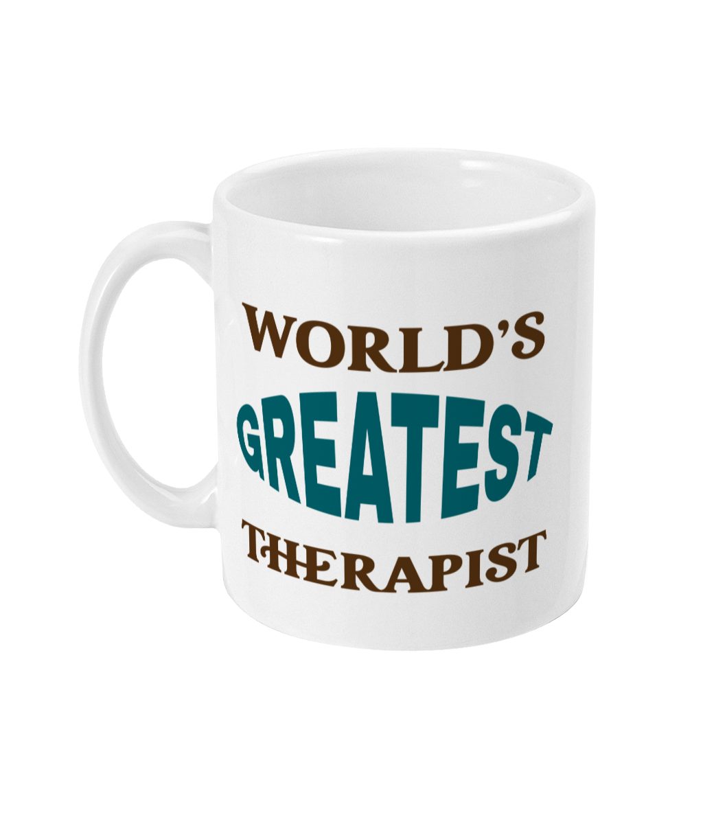White ceramic mug with bold text 'WORLD'S GREATEST THERAPIST' in brown and teal colors.