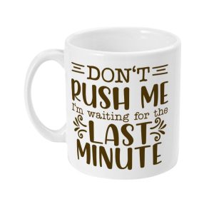 White ceramic mug with brown text saying, 'DON'T RUSH ME I'm waiting for the LAST MINUTE'
