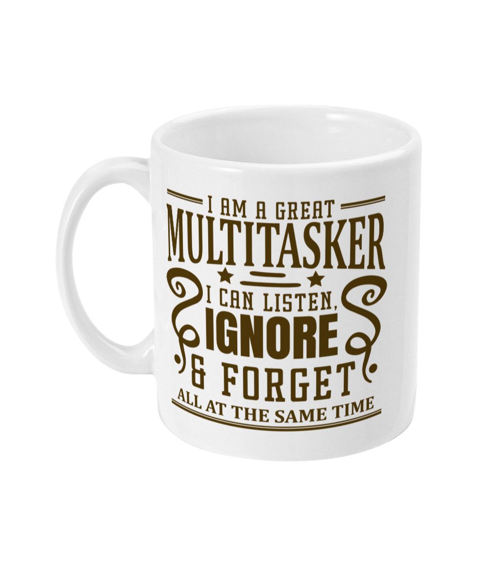 White ceramic mug with ornate brown text 'I AM A GREAT MULTITASKER I CAN LISTEN, IGNORE & FORGET ALL AT THE SAME TIME'