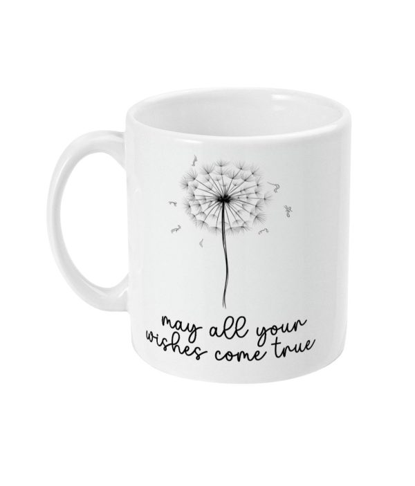 White ceramic mug featuring a black dandelion graphic with scattered seeds and the phrase 'may all your wishes come true'.